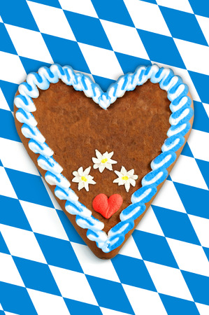Oktoberfest Gingerbread heart with copy space on bavarian white blue flagの写真素材