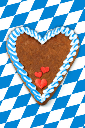 Oktoberfest Gingerbread heart with copy space on bavarian white blue flagの写真素材