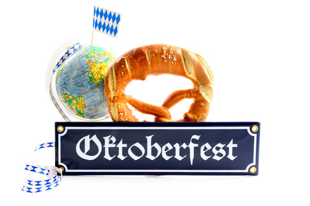 Oktoberfest metal sign with items like pretzel globe with bavarian flag on white isolated backgroundの写真素材