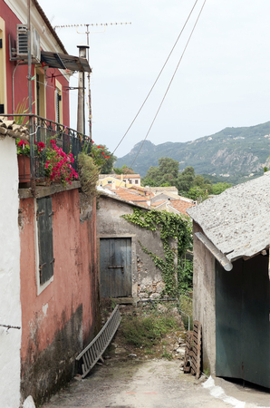 Cityscape of traditional mountain village Liapades at Corfu Island (Greece). View through the streets.の写真素材