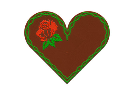 embroidered gingerbread heart with red rose.の写真素材