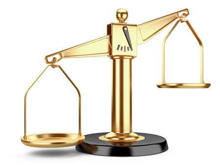 Golden scales of justice or a medical scales  isolated on white backgroundの写真素材