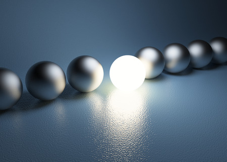 bright glowing sphere in a rowの写真素材