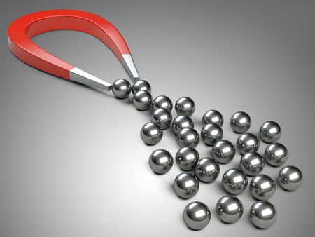 Big magnet attracting some chrome ball.  concept for marketing and business leadershipの写真素材