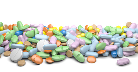 A pile of pills and tablets isolated on a white background
