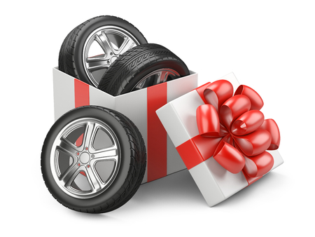 White open cardboard box gift with car tires whelles and red bow on a cap. 3d illustration isolated on a white backgound.の写真素材
