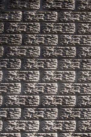 A flat view of a section of concrete precast fencing in the form of a bricked wallの写真素材