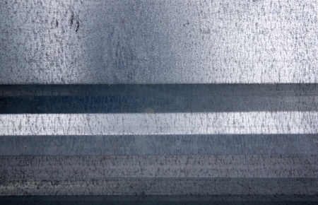 A closeup of a galvanised iron sheet of metalの写真素材