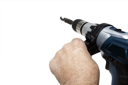 Hands holding electric drilling machine