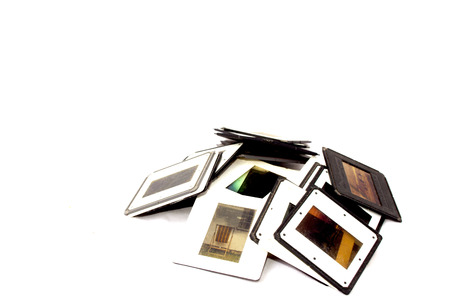Stack of photographic slides with black and white plastic bordersの写真素材