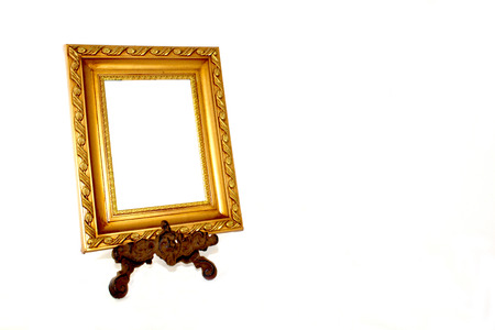 ornate gold picture frame on vintage metal stad