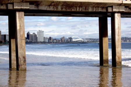 view of Durban's golden mile beachfront framed by pierの写真素材