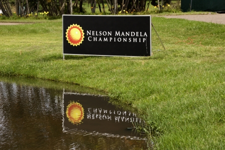 DURBAN, SOUTH AFRICA - DECEMBER 14, 2013: Siigboard at edge of water hazard on ninth fairway at the Nelson Mandela Championship presented by ISPS Handa at Mount Edgecombe Golf Club on December reflection14 in Durban, South Africa.のeditorial素材