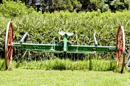 restored vintage red and green farm implementの写真素材