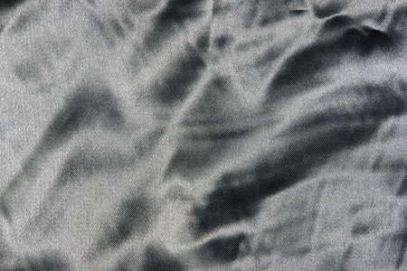 closeup of silver satin fabricl showing weaveの写真素材
