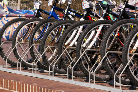 DURBAN, SOUTH AFRICA - MAY 24, 204: Closeup of stacked for hire cycle wheels on promenade on beachfront in Durban South Africaのeditorial素材