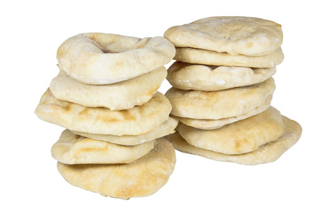 two piles containing thirteen stacked pitta breads