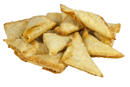 stack of folded and freshly fried samoosas