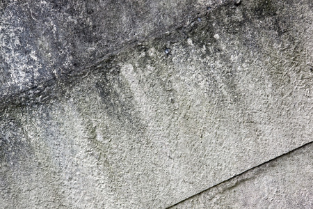 closeup of gray grimy panels on old precast wallの写真素材