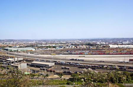 DURBAN, SOUTH AFRICA - SEPTEMBER 21, 2014: Bayhead road and railway tracks lead through heavy industrial and storage area toward entrance to harbor in Durban, South Africaのeditorial素材