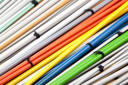 closeup colorful sets of paired knitting needles