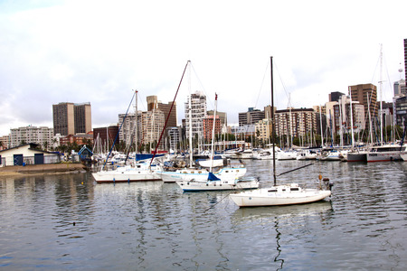 DURBAN, SOUTH AFRICA - JANUARY 30, 2015: Rainy early morning view of yacht mole against City Skyline in Durban, South Africaのeditorial素材