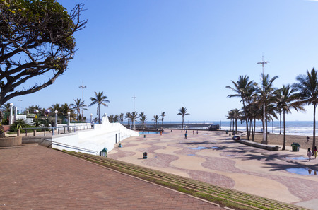 DURBAN, SOUTH AFRICA - DECEMBER 4, 2014: Many unknown people on promenade on beachfront in Durban, South Africaのeditorial素材