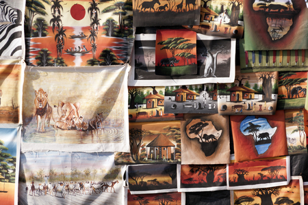 DURBAN, SOUTH AFRICA : APRIL 1, 2016: Closeup display of painted canvases on display on sidewalk stall on beach front in Durban South Africaのeditorial素材