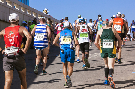 DURBAN, SOUTH AFRICA : MAY 29, 2016 : Many unknown spectators watch runners compete in the annual Comrades Marathon between Pietermaritzburg and Durban in South Africaのeditorial素材