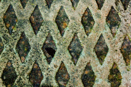 Close up detail of colorful diamond shape grungy patterns and texture backgroundの写真素材