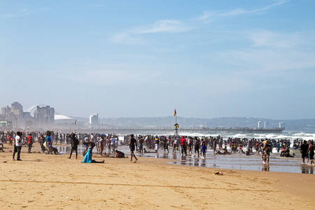 DURBAN, SOUTH AFRICA - DECEMBER 19, 2016: Many unknown people on afternoon visit on South Beach in Durban, South Africaのeditorial素材
