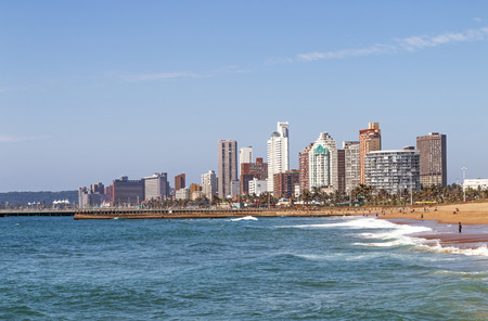 Coastal landscape with beach ocean blue sky and city skyline in Durban, South Africaの写真素材