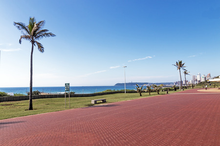Quiet morning red paved promenade on Golden Mile Beachfront landscape in Durban South Africaの写真素材