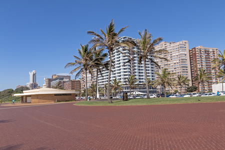 DURBAN, SOUTH AFRICA - MARCH 5, 2017: :  Early morning empty  paved promenade on beachfront against city skyline in Durban, South Africaのeditorial素材