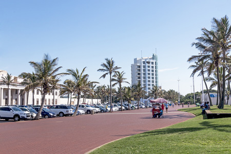 DURBAN, SOUTH AFRICA - MARCH 5, 2017:  Many Early morning unknown people walking on paved promenade on beachfront in Durban, South Africaのeditorial素材