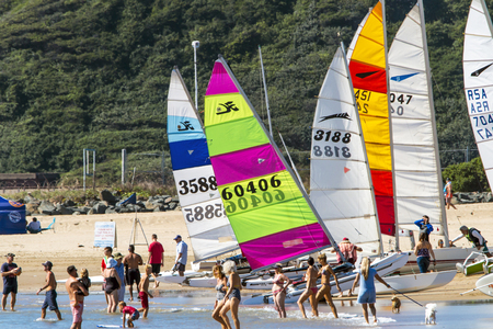 DURBAN, SOUTH AFRICA ; APRIL 24, 2017: Many unknown people amongst colorful yachts enjoying visit to beach in Durban, South Africaのeditorial素材