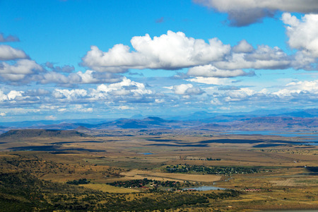 Above view of cold dry winter landscape and  mountains against blue cloudy sky in the Kwa Zulu Natal  in South Africaの写真素材