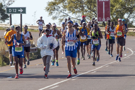 CATO RIDGE, DURBAN, SOUTH AFRICA : JUNE 4, 2017: Many unknown spectators and  runners participate  in the Comrades Marathon between Durban and Pietermaritzburg in South Africaのeditorial素材