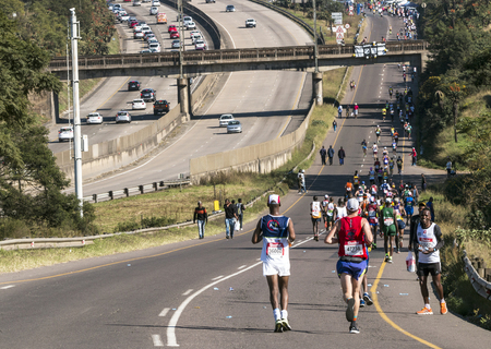 CATO RIDGE, DURBAN, SOUTH AFRICA : JUNE 4, 2017: Many unknown spectators and  runners participate  in the Comrades Marathon between Durban and Pietermaritzburg in South Africaのeditorial素材