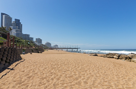 Empty Umhlanga Rocks beach and sea against blue sky coastal landscape in Durban, South Africaのeditorial素材