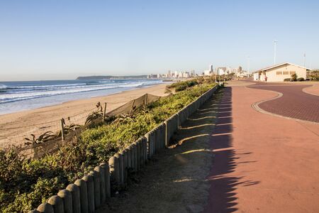 Pedestrian walkway on Durban beachfront with dune rehabilition in foregroundの写真素材