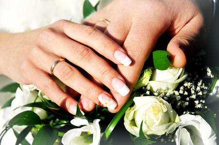 wedding rings on the hands of the newlyweds, wedding dayの写真素材