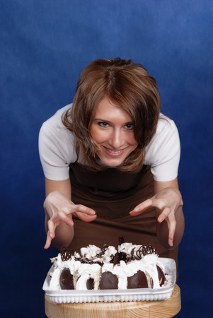 girl and cake, holding sweets, closeup, studioの写真素材