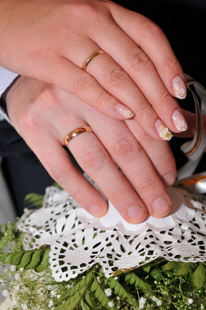 wedding rings on the hands of the newlyweds, wedding dayの写真素材