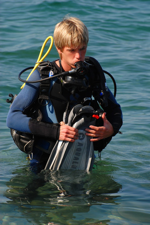 young man diving, dressed in a suitの写真素材