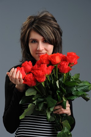 girl with flowers, roses, bouquet, close up, studioの写真素材