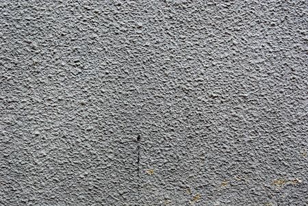 very detailed grey exterior wall texture with tiny cracksの写真素材