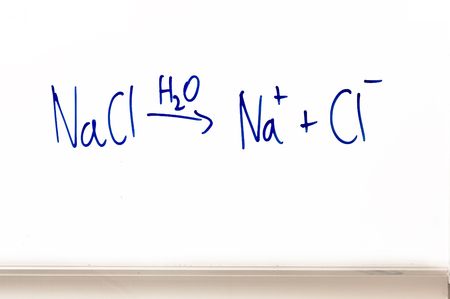 an equation (chemistry) showing dissoatiation of table salt in waterの写真素材