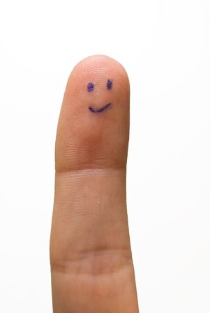 happy smiley on human finger isolatedの写真素材