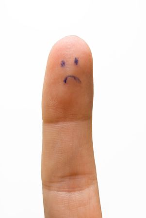 sad smiley on human finger isolatedの写真素材